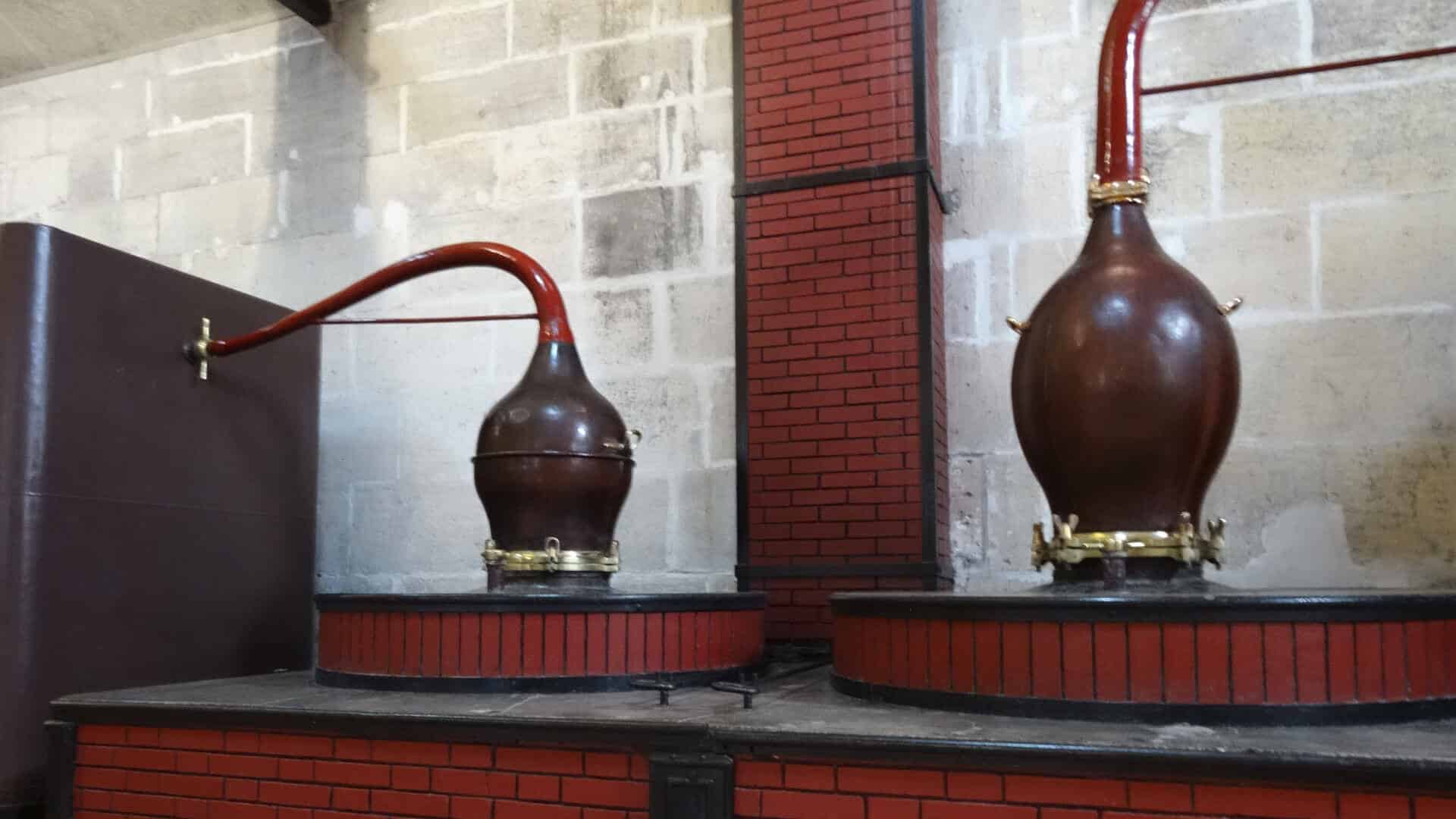 Old wood-fired stills with an onion shape head capital for cognac
